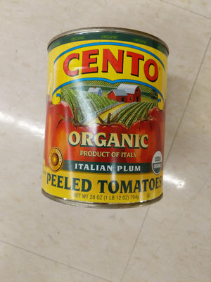 Organic whole peeled tomatoes in juice with basil leaf