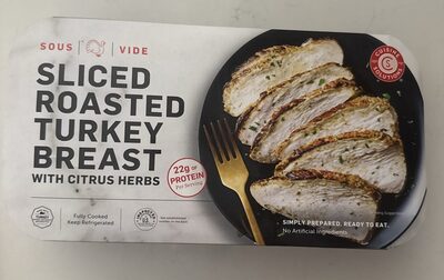 Sliced roasted turkey breast with citrus herbs