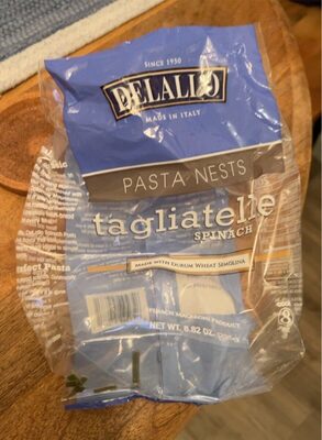 Spinach tagliatelle pasta nests made with durum wheat semolina